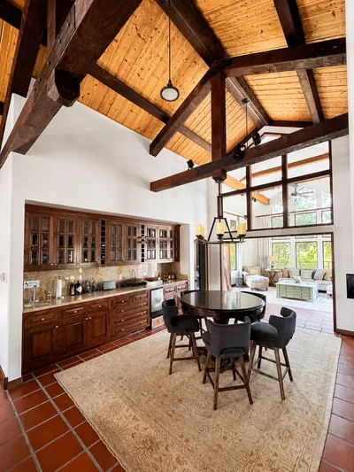 Interior living room with painted walls, large windows, and hardwood flooring